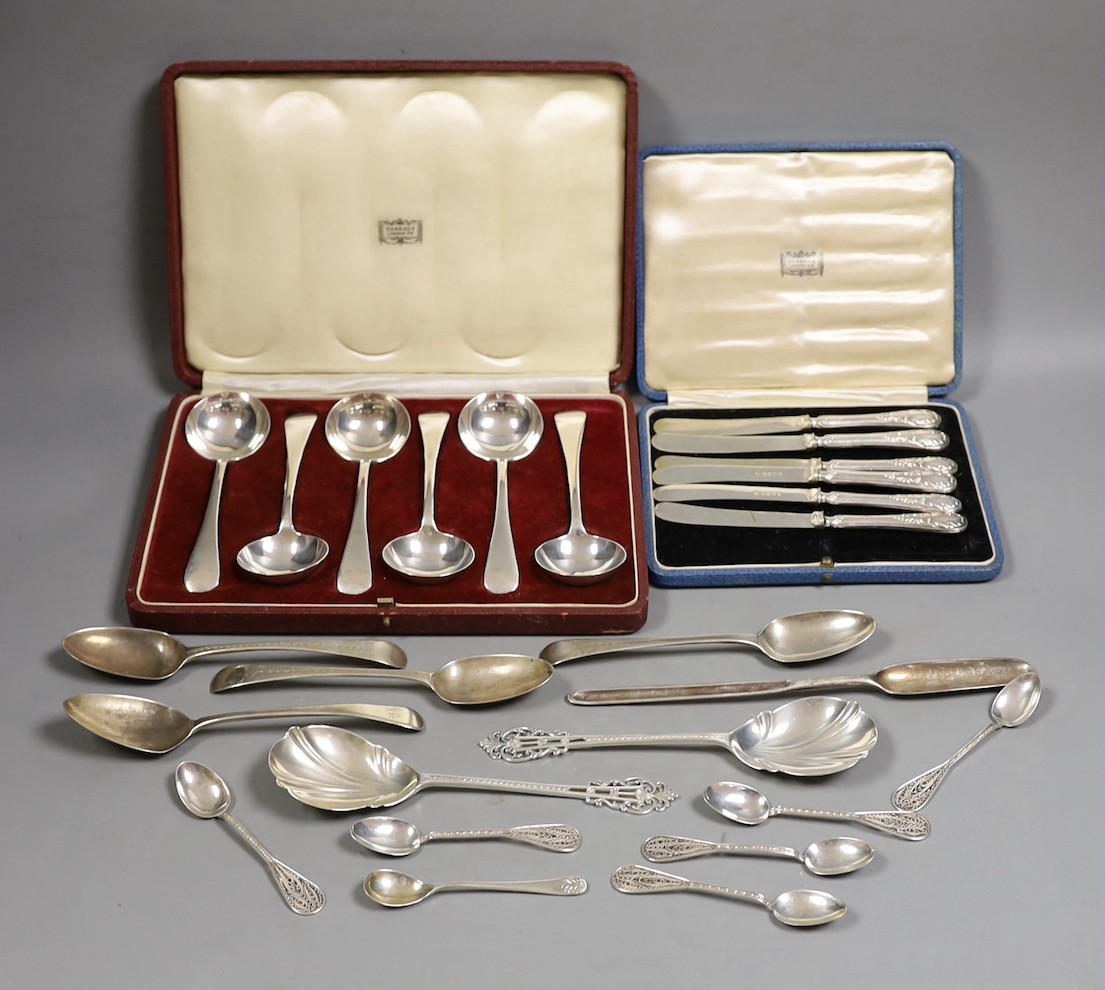 A cased set of George V silver Old English pattern soup spoons, Harrod's Ltd, Sheffield, 1934 and a cased set of six silver handled tea knives and sundry silver and white metal flatware.